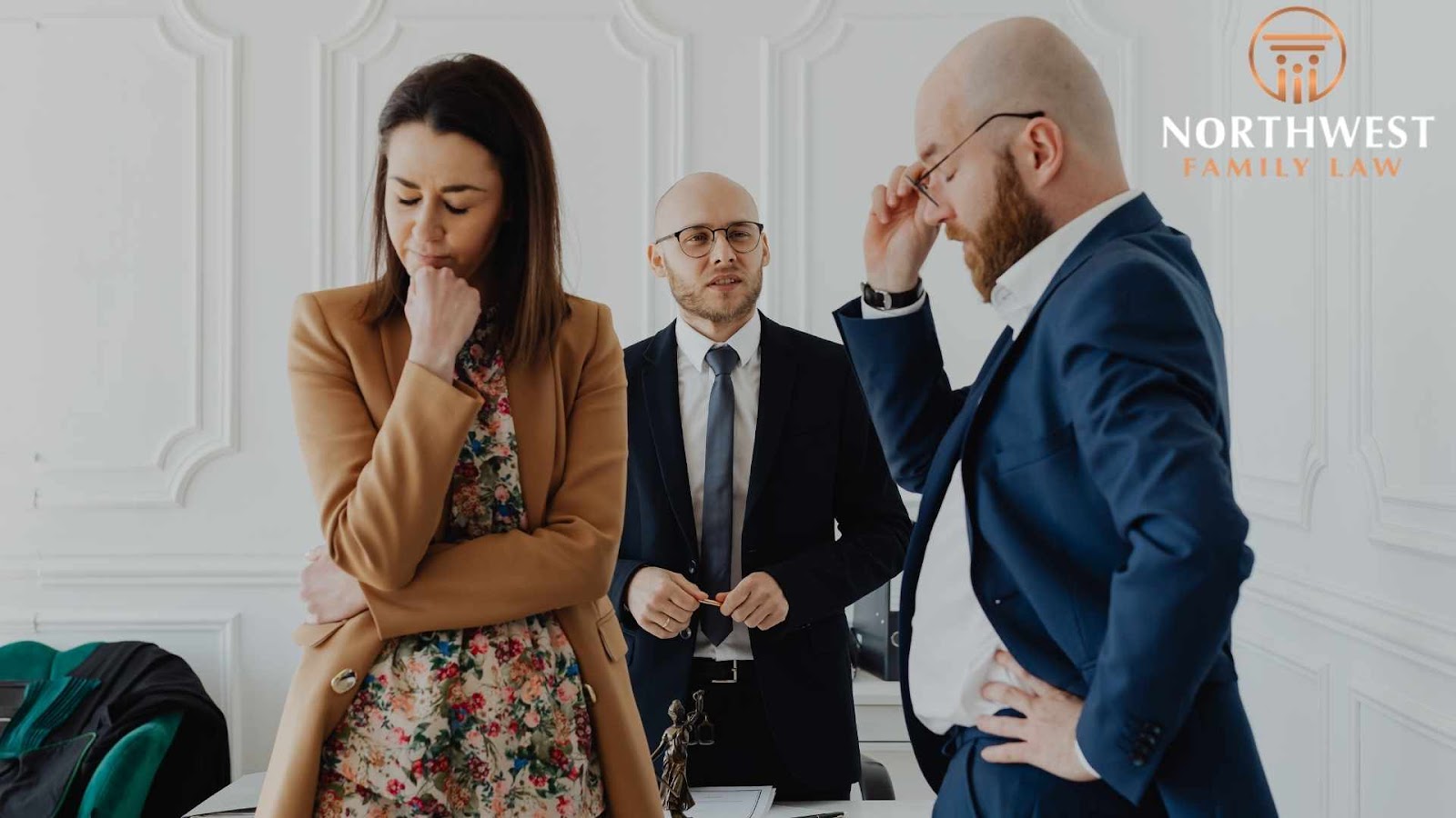 Three people discussing legal matters in office