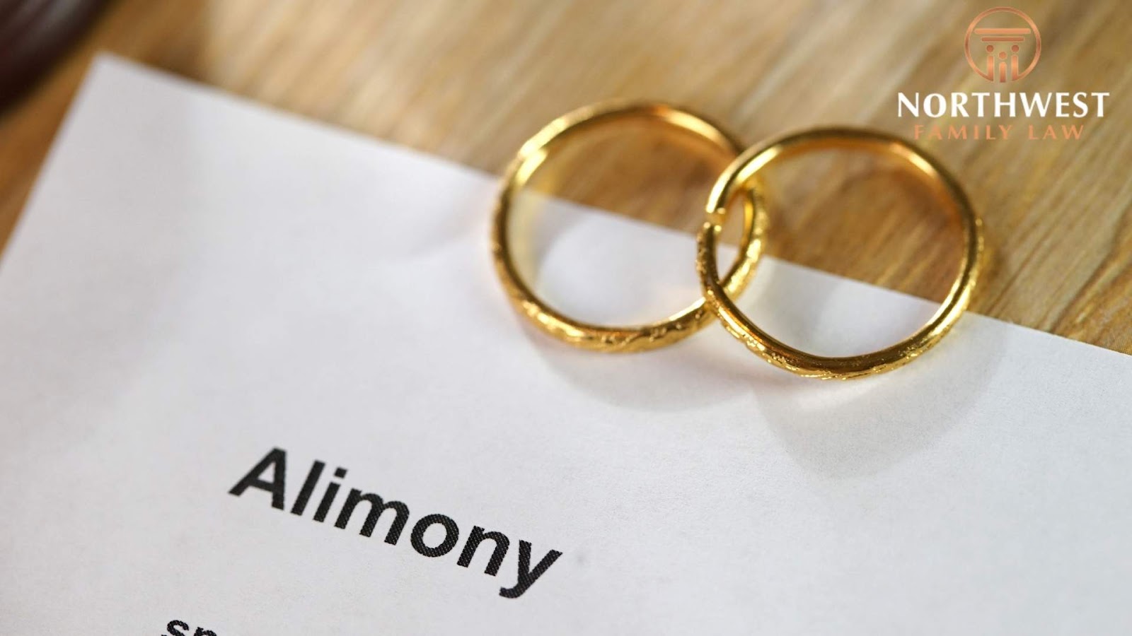 Wedding rings on alimony document, Northwest Family Law.