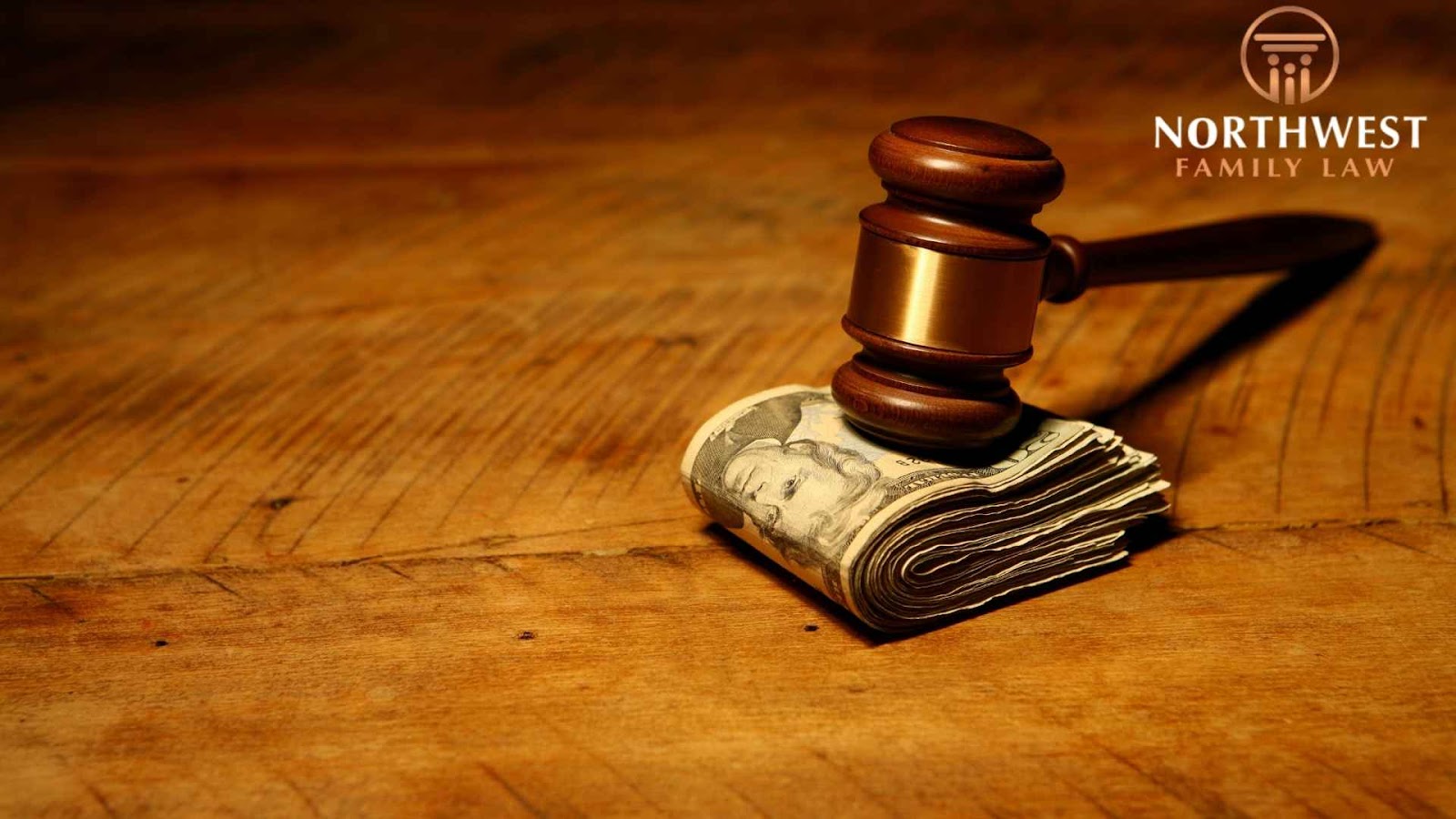 Gavel on stack of money, Northwest Family Law logo.