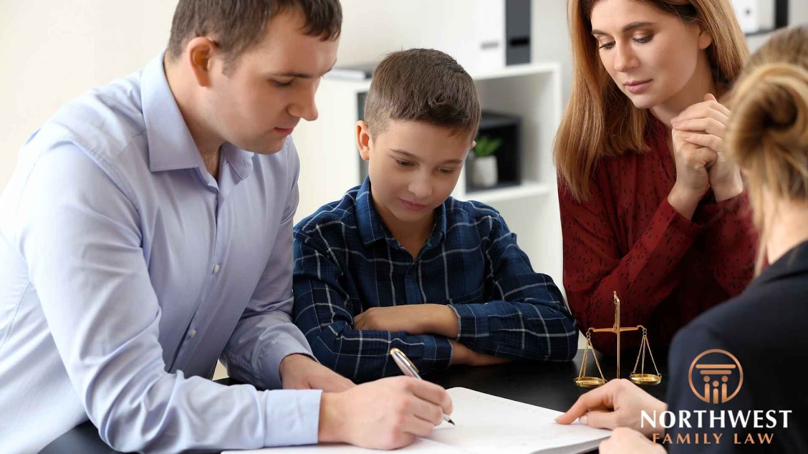 Family discussing legal documents with attorney.