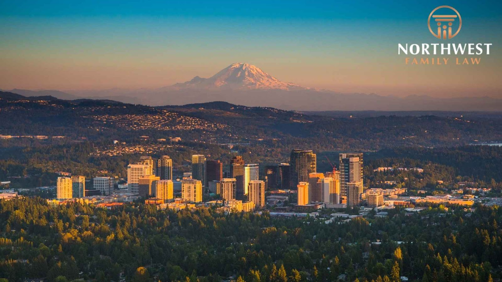 A wide shot of a Bellevue city near a mountain, where child custody services by Northwest Family can be provided.