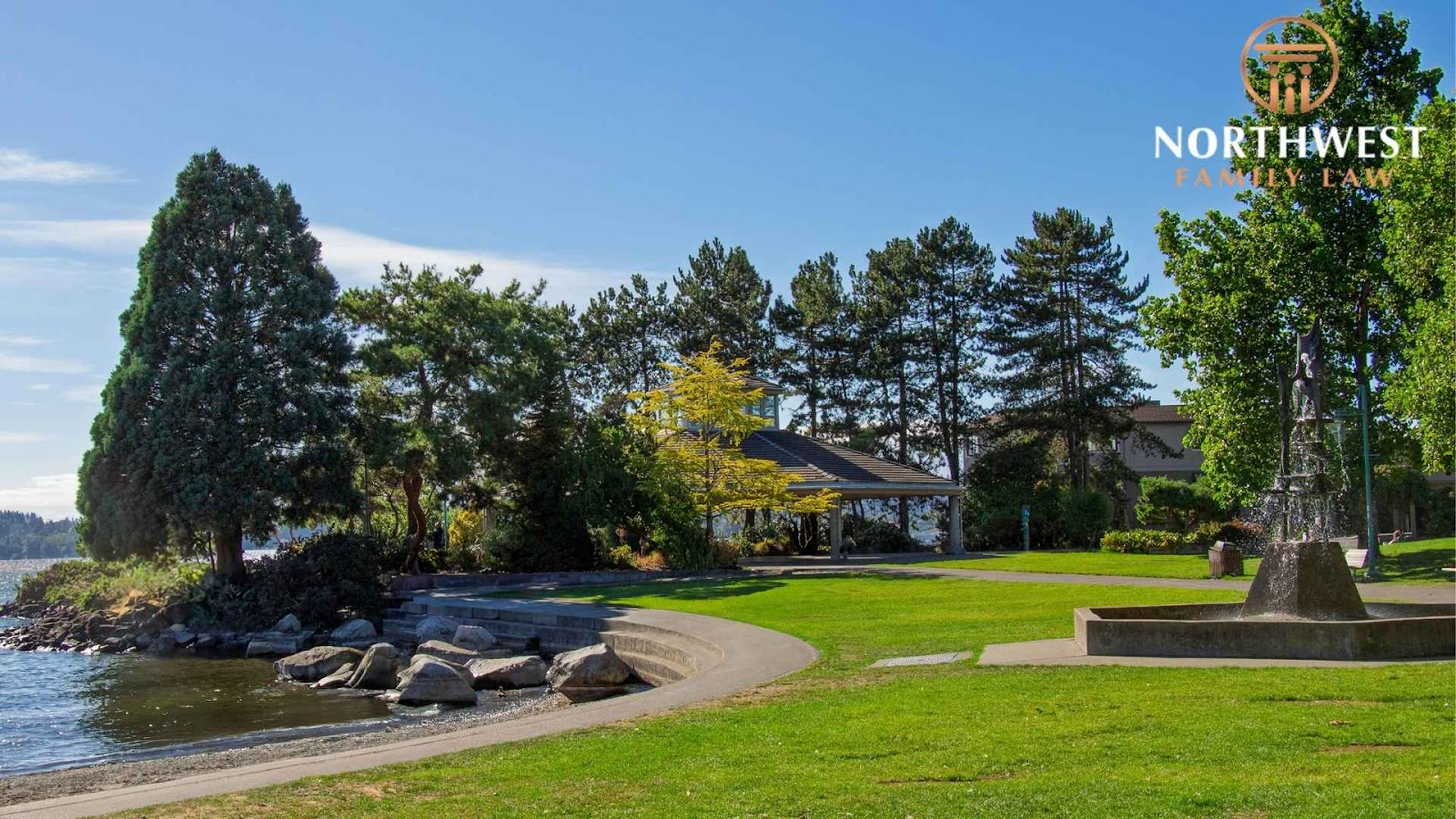 Lakeside park in Kirkland, WASHINGTON with trees and pavilion, sunny day.