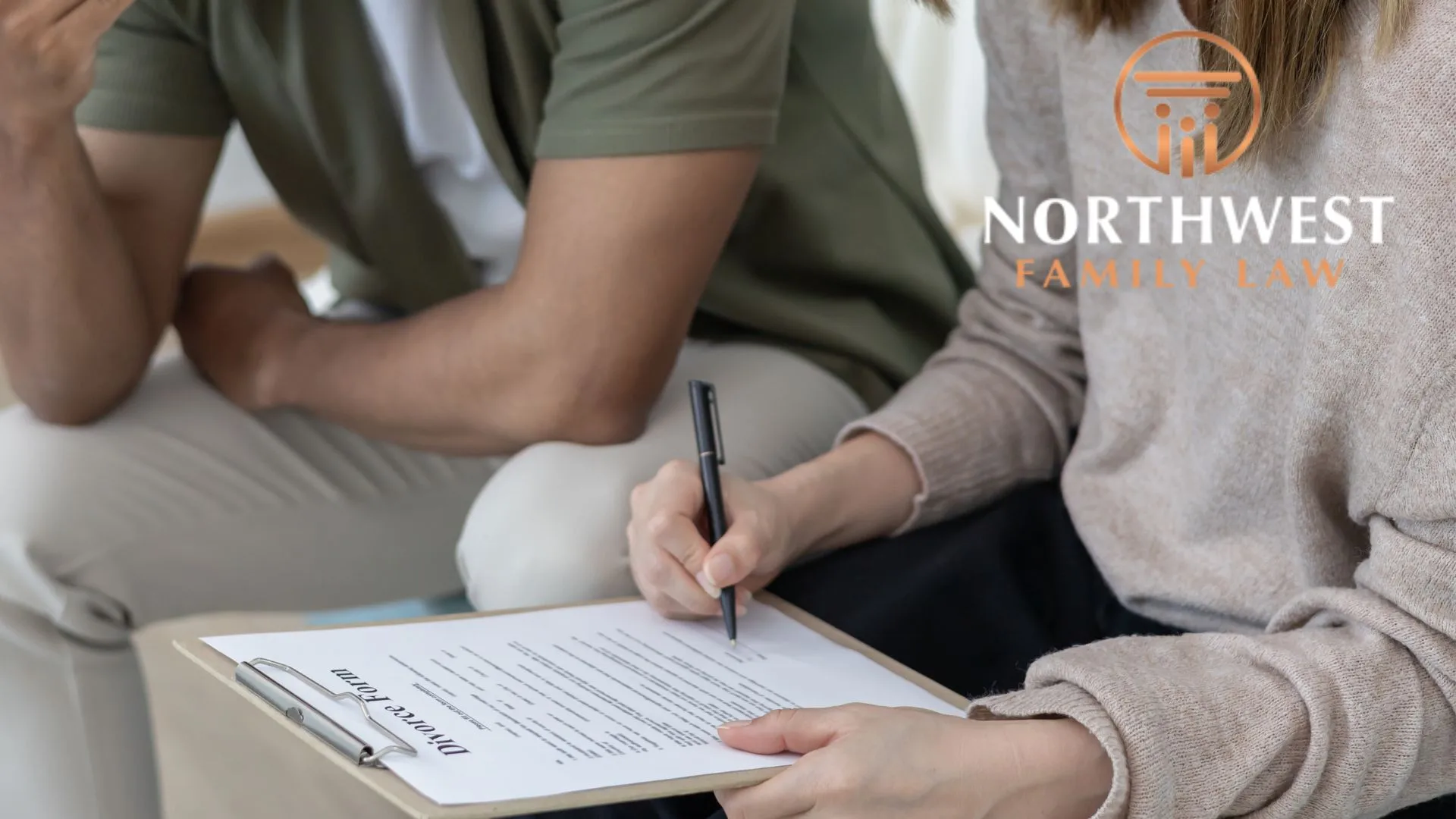 Woman signing divorce papers beside concerned partner